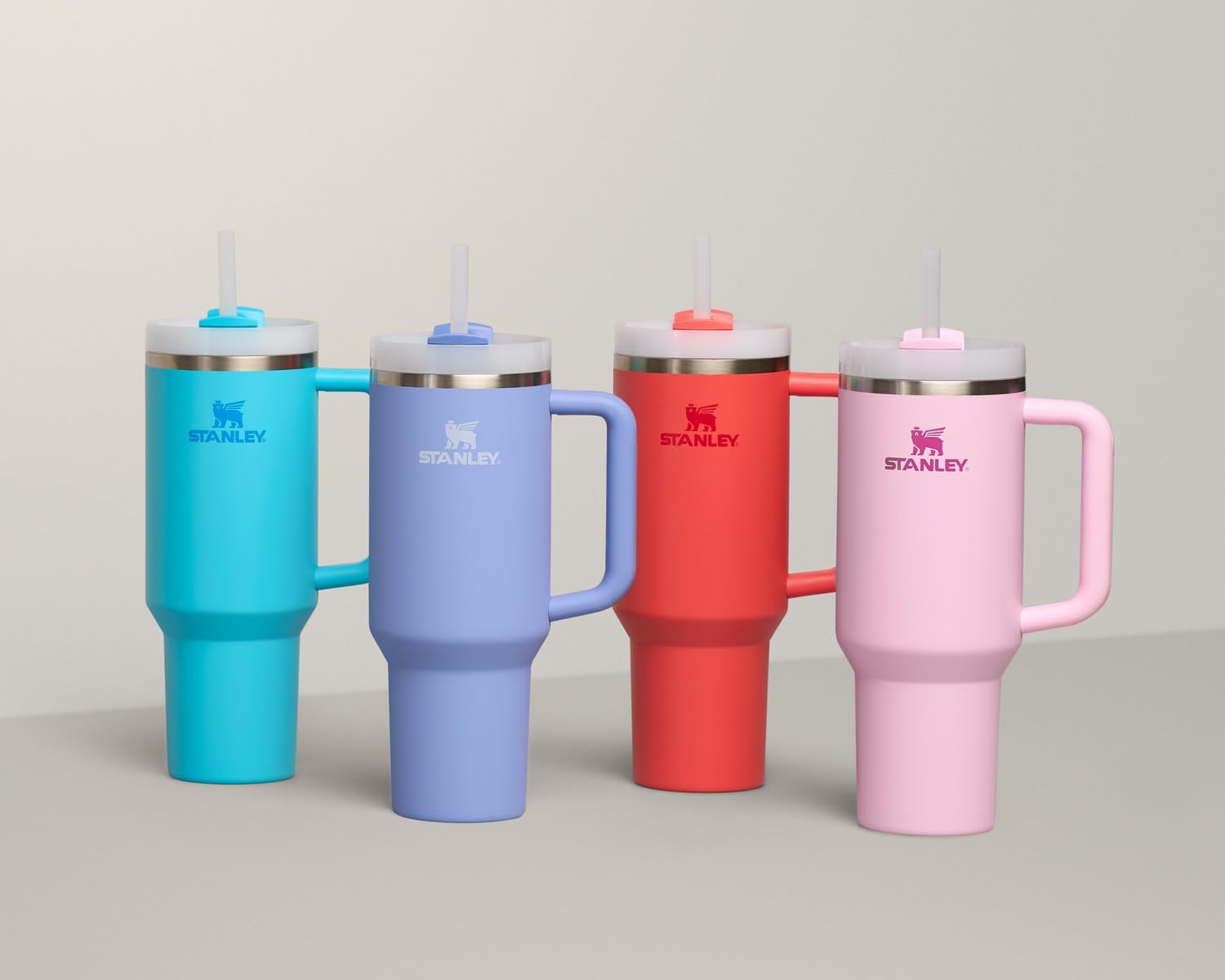 STANLEY Quencher H2.0 Tumbler with Handle and Straw 40 oz | Flowstate 3-Position Lid | Cup Holder Compatible for Travel | Insulated Stainless Steel Cup | BPA-Free | Hot Coral